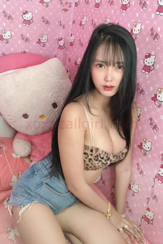 KL Escort Girl Advertisement for "Melayu Escort Service" featuring a woman holding a sign with the website address. Malaysia Sex Service