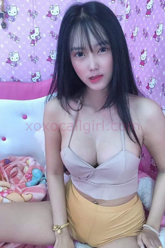 KL Escort Girl Advertisement for "Melayu Escort Service" featuring a woman holding a sign with the website address. Malaysia Sex Service