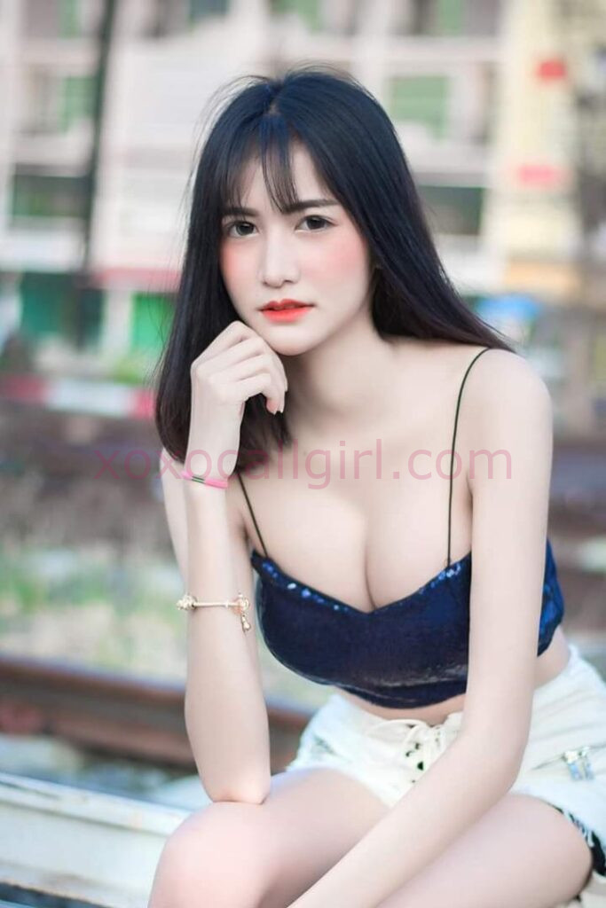 KL Escort Girl Malay Escort Amoi advertisement with woman holding a sign for Escortamoi.com. Malaysia Sex Service