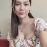 KL Escort Girl Gillian, a Vietnam Escort in Kuala Lumpur, poses in a patterned dress. Malaysia Sex Service