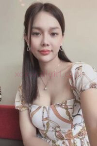 KL Escort Girl Gillian, a Vietnam Escort in Kuala Lumpur, poses in a patterned dress. Malaysia Sex Service