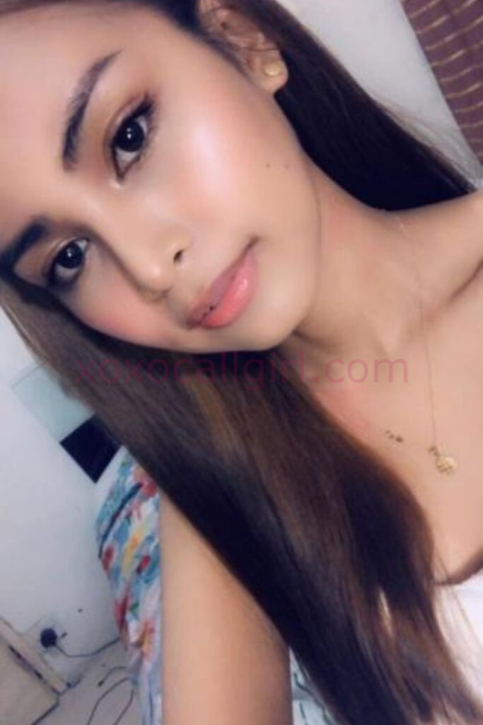 KL Escort Girl Malay Escort Amoi advertisement with woman holding a sign for Escortamoi.com. Malaysia Sex Service