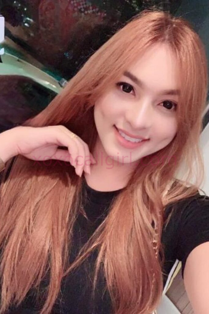 KL Escort Girl Portrait of a smiling Malay woman with long hair, possibly a Local Malay Escort in Kuala Lumpur. Malaysia Sex Service