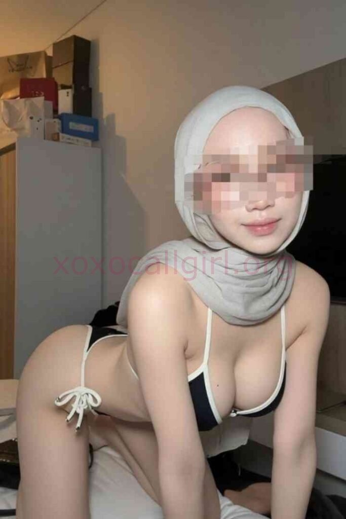 KL Escort Girl Woman in hijab and bikini posing on a bed Malaysia Sex Service
